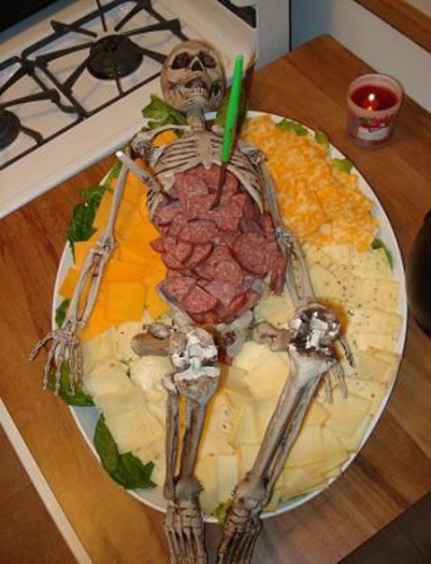 a skeleton filled with salami and different kinds of cheese is a scary idea for an adult party