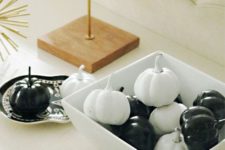 04 a simple black and white pumpkin display in a dish is a timeless idea