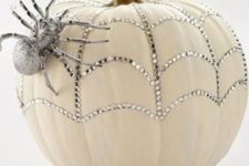 05 a sparkling pumpkin with rhinestones and a a silver spider for a glam feel