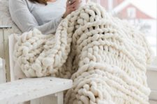 06 a chunky knit wool ivory-colored blanket is amazing for indoor and outdoor cuddling