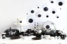 06 a fun black and white Halloween dessert table with lots of googly eyes everywhere