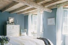 06 a gorgeous wood ceiling with beams and wood floors create a stunning pastel space