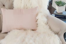 06 a throw blanket of white faux fur will add a glam feel and will fit many decor styles