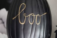 06 decorate a matte black pumpkin with a simple gold pen writing whatever you like