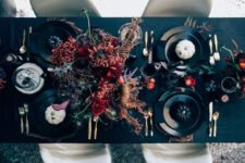 08 elegant moody Halloween tablescape with dark florals, black and white pumpkins and black matte plates