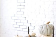 10 neutral pumpkins of green shades, with black candles and in faux fur look realy chic
