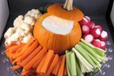 12 a gorgeous tray with a pumpkin holding sauce and fresh veggies placed around
