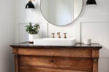 12 a rustic wood vanity with a stone counter adds a vintage and cozy feel