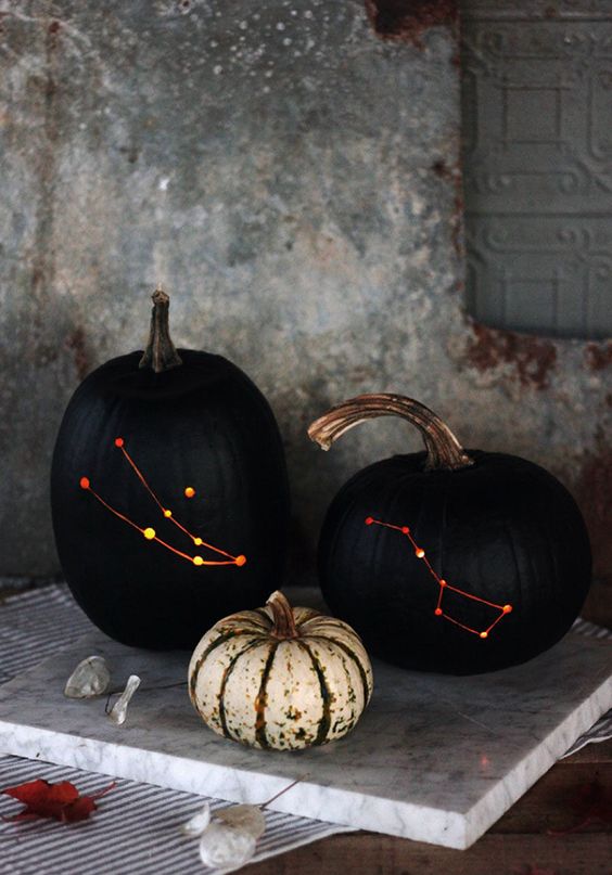 constellation pumpkin carving is a bold idea for Halloween
