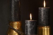 14 black candle in gold candle holders for elegant and sophisticated Halloween decor