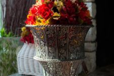 DIY faux fall flower topiary in a vintage urn