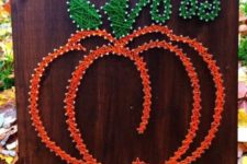 02 a chic contour pumpkin string art with green leaves