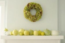 02 a selection of yellow and green pumpkins and a greenery wreath for a modern fall look