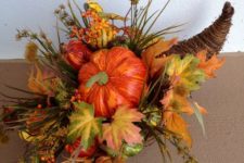 03 a fall cornucopia with faux leaves, grass and pumpkins in bold fall colors