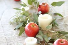 a foliage, apple and candle table runner for a cozy Thanksgiving or just fall tablescape