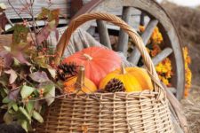 04 a basket with pumpkins and pinecones is a perfect idea for fall and Thanksgiving decor