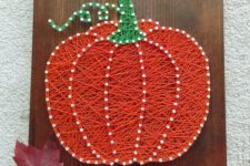 04 a colorful pumpkin string art with white nails looks unusual