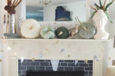 04 a mantel with green and white pumpkins, feathers and pinecones arranged