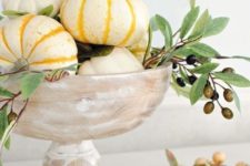 05 a whitewashed bowl with pumpkins and olive branches with olives