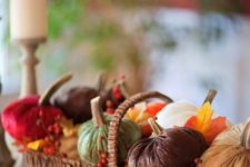 06 a basket with pumpkins of colorful fabric, faux leaves and berries for a rustic look