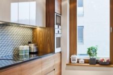 08 modern wooden cabinets with a black countertop and neutral cabinets hanging