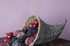 10 a chic cornucopia with apples, grapes, cabbage looks moody and very chic