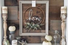 10 a cool frame and embroidery hoop wreath, some pumpkins, antlers and candles for a modern rustic space