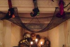 10 a faux fireplace with skulls, skeletons and candles