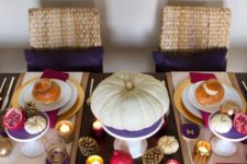 12 a colorful modern tablescape in purple, fuchsia and gold, with pumpkins and pinecones look super cheerful