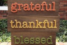 15 a Thanksgiving sign with three words in green, yellow and orange
