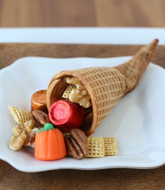 an edible ice cream cone cornucopia filled with various candies is great for kids