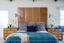 16 an eclectic space with a tall brown leather headboard for a textural touch