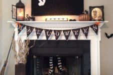 put faux witch’s legs into a fireplace to make it scarier