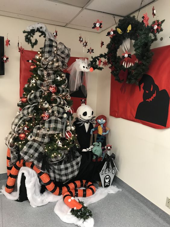 Halloween decor with a bold tree with porps including all the main characters, lights and checked ribbon, a Halloween wreath