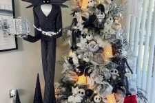 Nightmare Before Christmas decor with a themed tree, Jack Skellington, some lights and silver pumpkins is wow