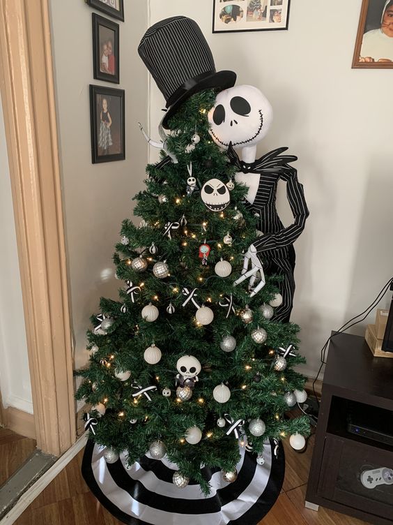 a Jack Skellington prop next to the tree with themed ornaments are a cool solution for Halloween and Christmas