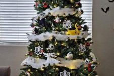 a Nightmare Before Christmas tree with a snake, some lights, themed ornaments and lights is a super fun idea for Halloween and Christmas