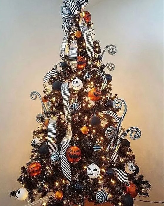a black Christmas tree with lights, orange, black and white ornaments and Jack Skellington ones, striped ribbons and curls