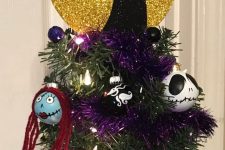 a bold Nightmare Before Christmas tree with themed ornaments, lights and a creative and bold topper is amazing