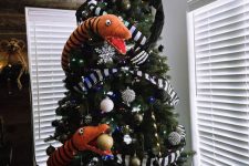 a perfect Nightmare Before Christmas tree with snakes, striped ribbons, bold ornaments and Jack Skellington