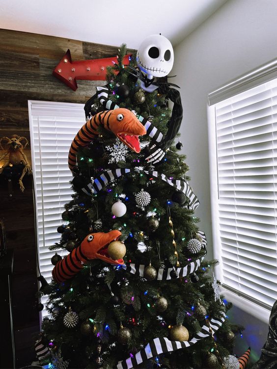 a perfect Nightmare Before Christmas tree with snakes, striped ribbons, bold ornaments and Jack Skellington