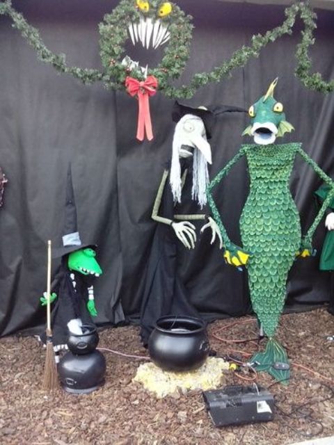 outdoor Halloween decor with cauldrons and a scene from Nightmare before Christmas is great for styling your outdoor spaces