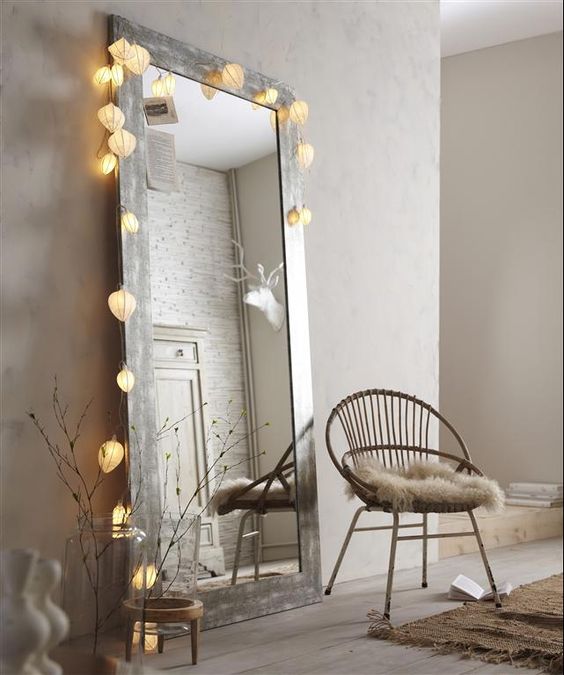 a mirror in a reclaimed frame with a light garland on it will make it cuter