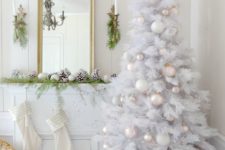 03 a white Christmas tree with pearly and blush ornaments and some pearl strands for a vintage chic touch