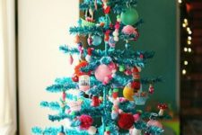 05 a shiny turquoise pipe cleaner tree with super bold ornaments for a kids’ space