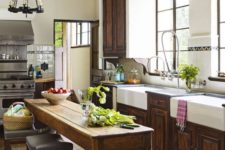 08 a rustic vintage kitchen island serves both as a dining zone and a cooking one