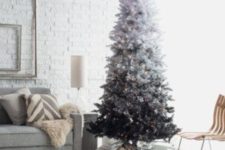 08 vintage-inspired white to black Christmas tree with lights looks very chic