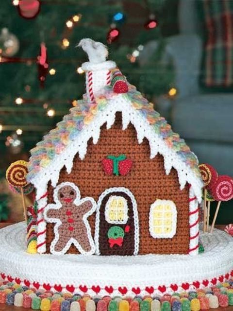 a crochet gingerbread house and man is a unique decoration for Christmas