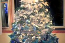 10 a Christmas tree with ombre decor from white to electric blue looks very bold