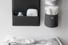 10 attach some fabric holders for diapers and other stuff over the changing table